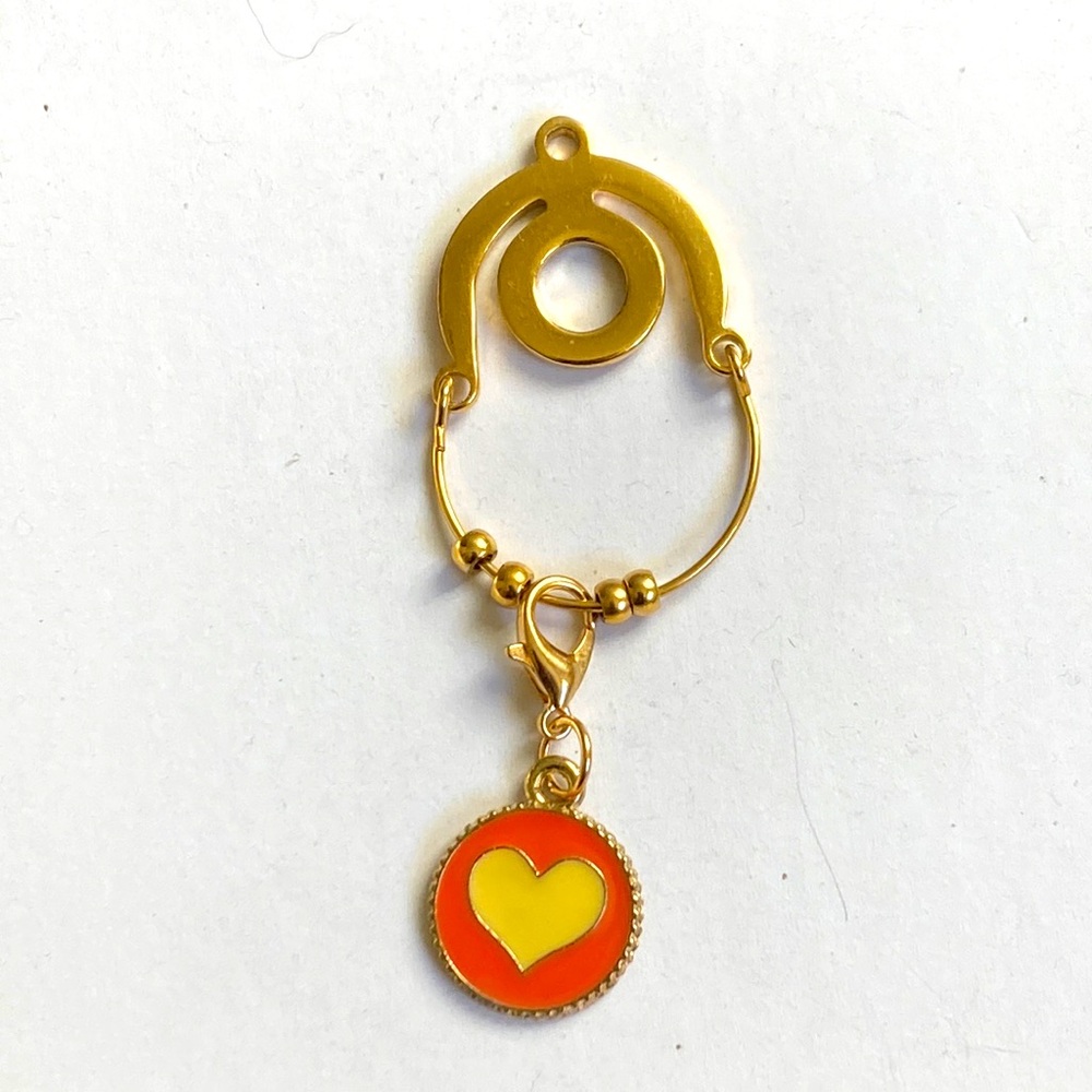 Gold plated charm holder with heart charm